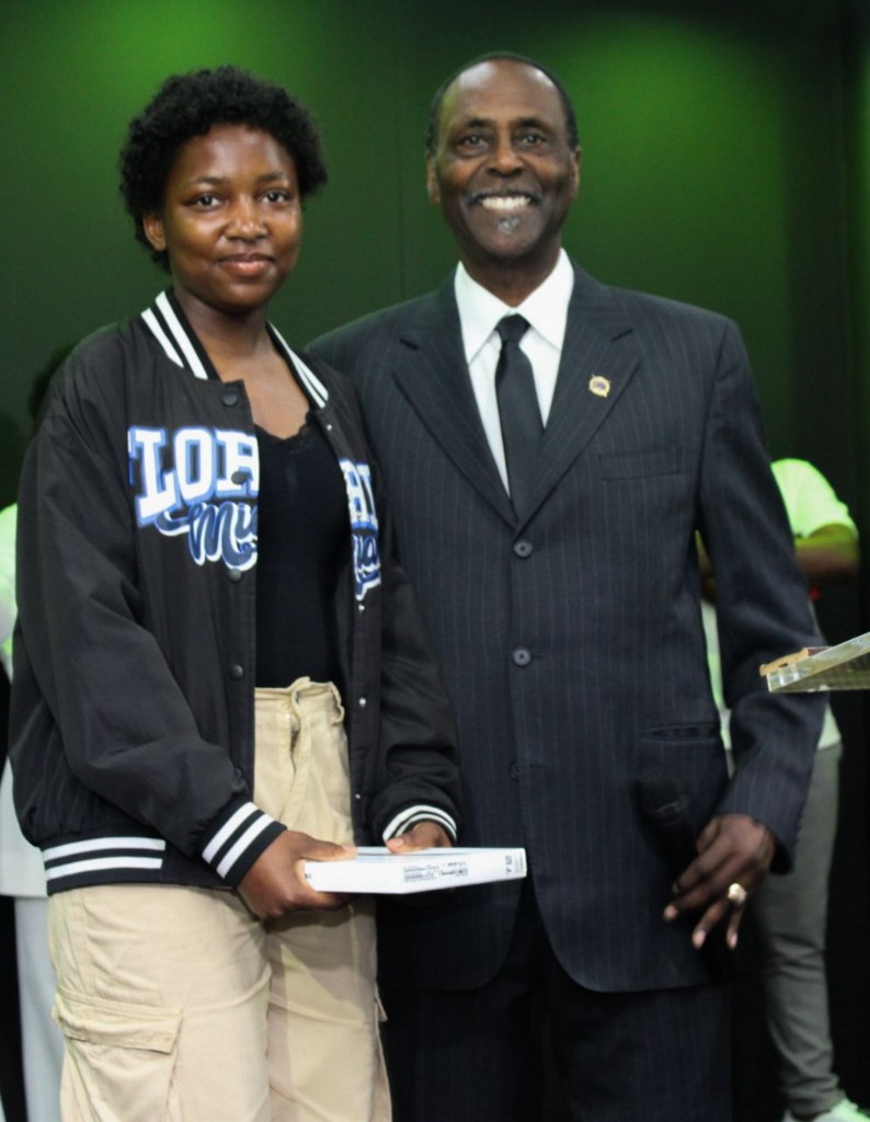 Young woman and mentor holding a tablet gift together