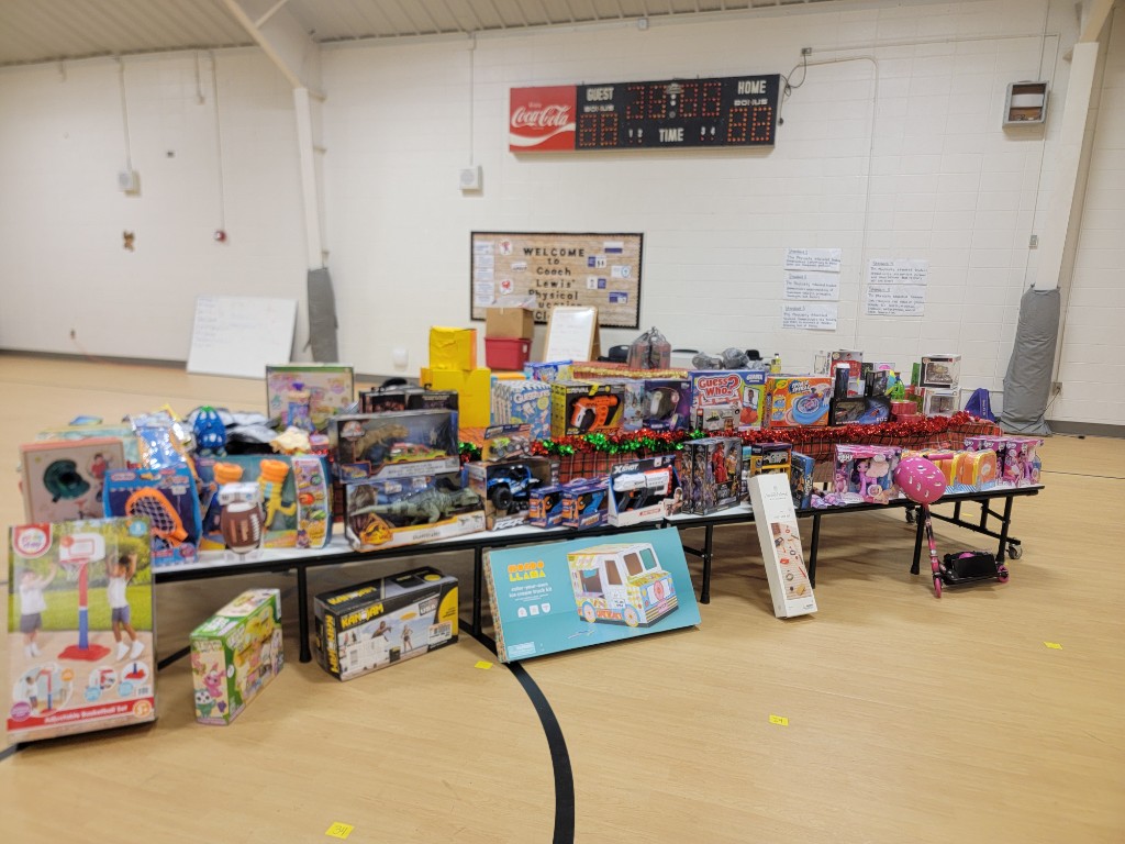 Tables full of donated toys for the Christmas give-away